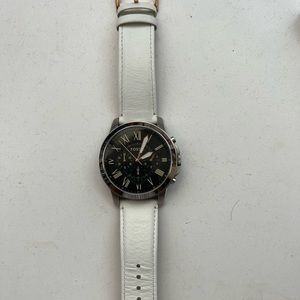 Unisex Fossil watch with two genuine leather bands.